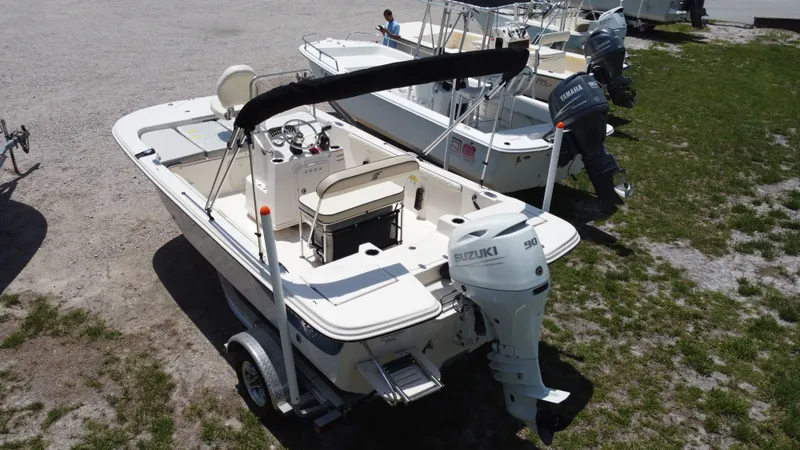 Slide: The Image of 2023 Carolina Skiff 17 LS boat with Suzuki engine on trailer. - 2