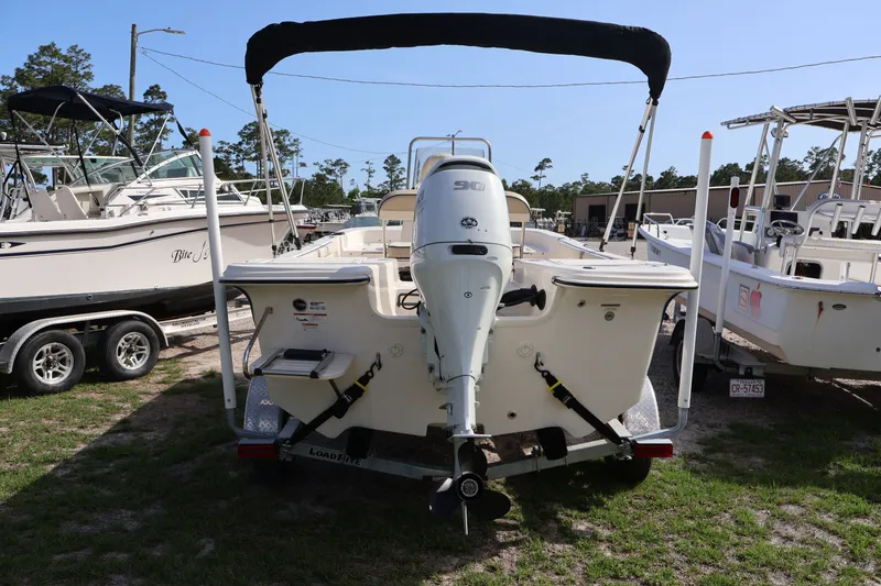 Slide: The Image of Rear view of a 2023 Carolina Skiff 17 LS boat with outboard motor. - 6