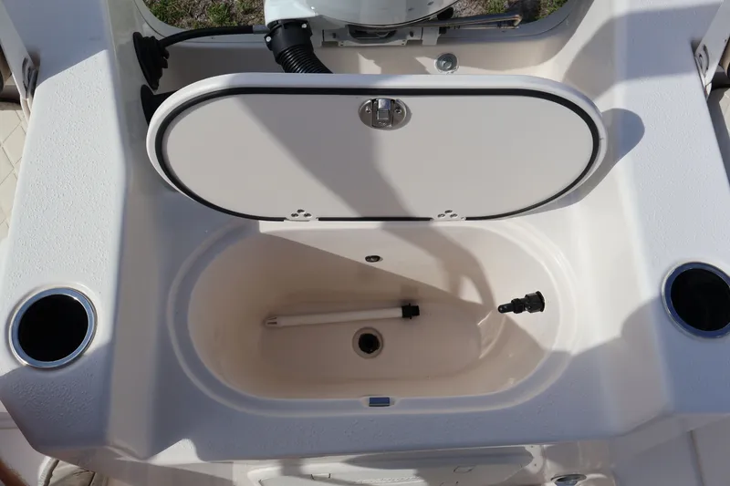 Slide: The Image of 2023 Carolina Skiff 17 LS boat, open storage compartment. - 9
