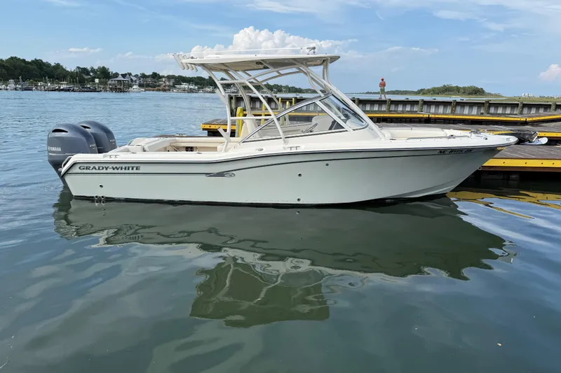 The Image of 2019 Grady-White Freedom 255 boat docked on calm water. - 1