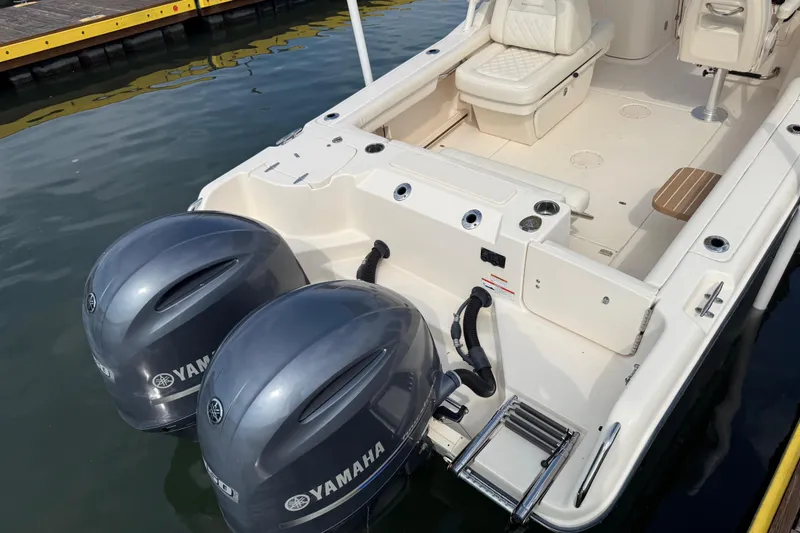 Slide: The Image of 2019 Grady-White Freedom 255 boat with Yamaha outboard motors at dock. - 12