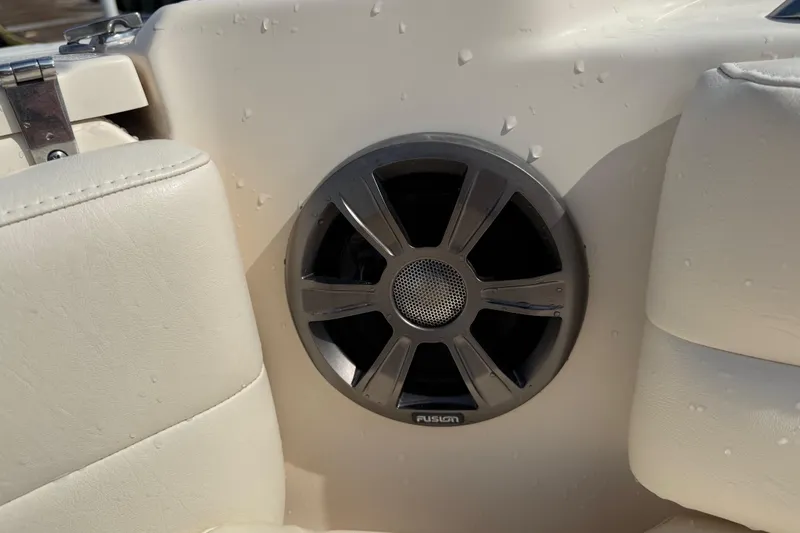 Slide: The Image of Boat speaker on 2019 Grady-White Freedom 255, surrounded by beige upholstery. - 20