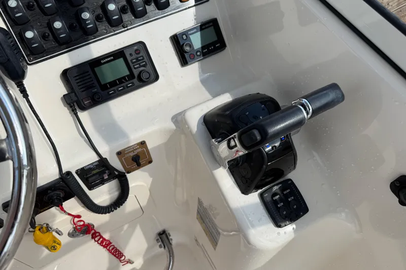 Slide: The Image of Control panel of a 2019 Grady-White Freedom 255 boat with navigation equipment. - 27