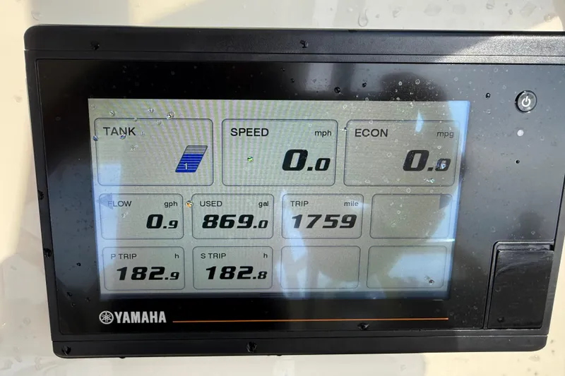 Slide: The Image of Yamaha display on 2019 Grady-White Freedom 255 showing fuel and trip data. - 30