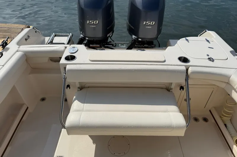 Slide: The Image of 2019 Grady-White Freedom 255 boat with twin Yamaha 150 engines at dock. - 36