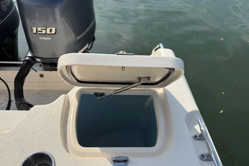 Slide: The Image of Open hatch on 2019 Grady-White Freedom 255 boat, near Yamaha 150 engine. - 37