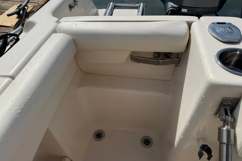 Slide: The Image of 2019 Grady-White Freedom 255 boat interior with seating and cup holder. - 40