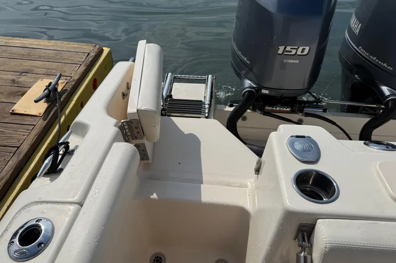 Slide: The Image of 2019 Grady-White Freedom 255 boat with Yamaha 150 engines at dockside. - 41