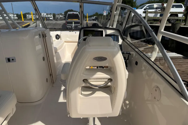 Slide: The Image of 2019 Grady-White Freedom 255 boat interior with helm and seating area. - 42