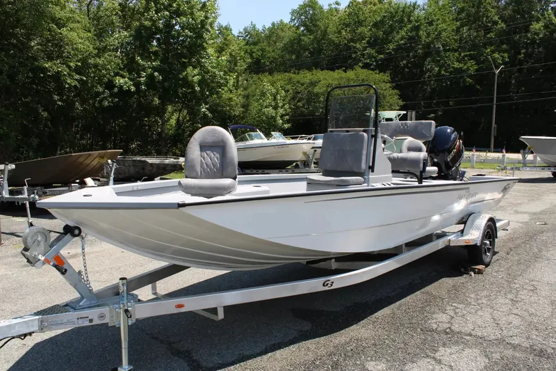 The Image of 2026 G3 Bay 21 GX boat on trailer outdoors. - 1
