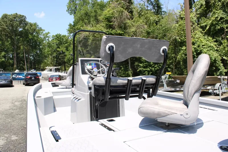 Slide: The Image of 2026 G3 Bay 21 GX boat with console and seating outdoors. - 12