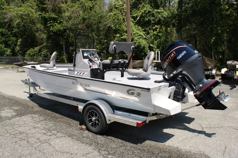 Slide: The Image of 2026 G3 Bay 21 GX boat with Yamaha engine on trailer. - 3