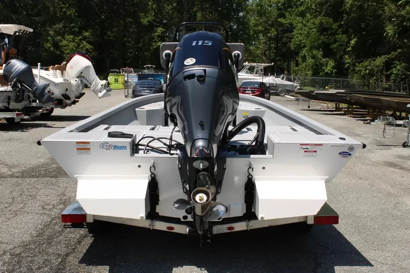 Slide: The Image of 2026 G3 Bay 21 GX boat with outboard motor in parking lot. - 4