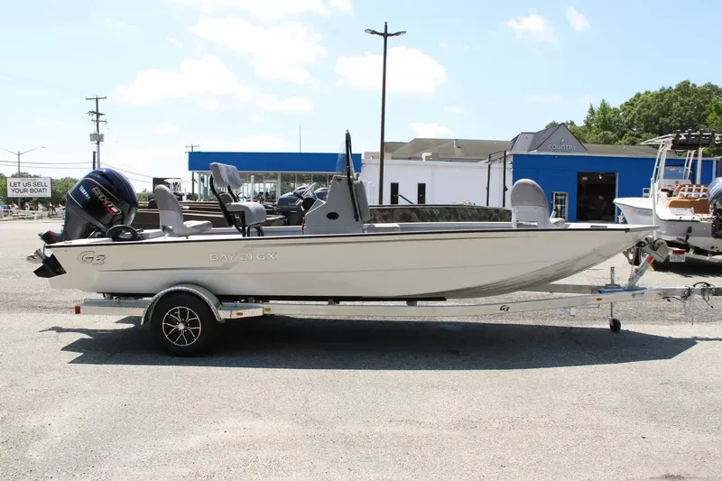 Slide: The Image of 2026 G3 Bay 21 GX boat on trailer outdoors. - 6