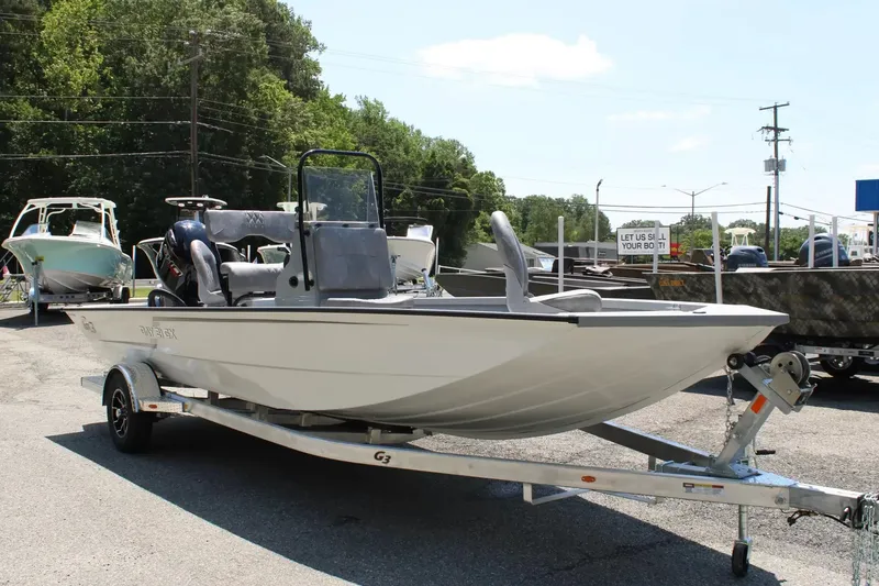 Slide: The Image of 2026 G3 Bay 21 GX boat on trailer parked outdoors. - 7