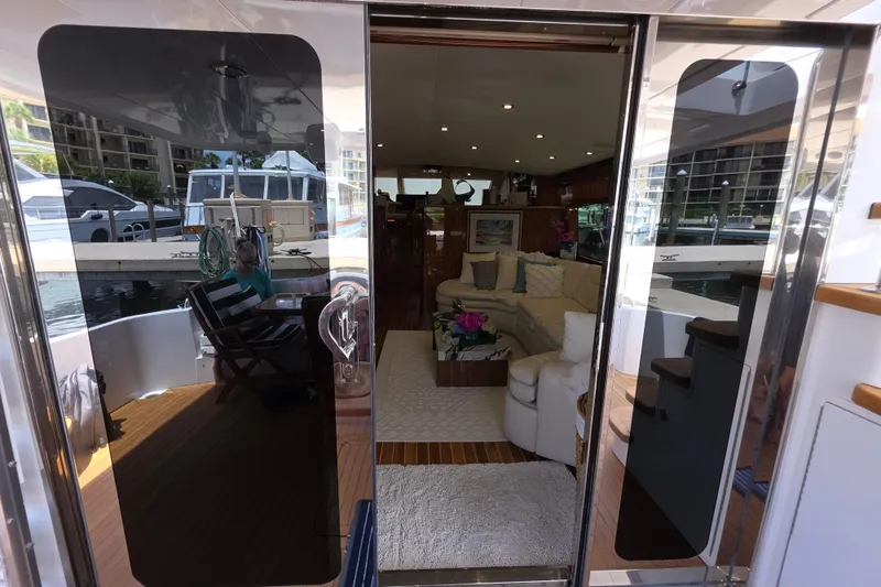 Slide: The Image of Luxurious interior of a 2008 Hatteras 64 Motor Yacht, featuring elegant seating and modern design. - 18