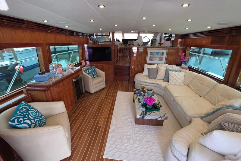 Slide: The Image of Luxurious interior of a 2008 Hatteras 64 Motor Yacht with elegant seating and decor. - 19