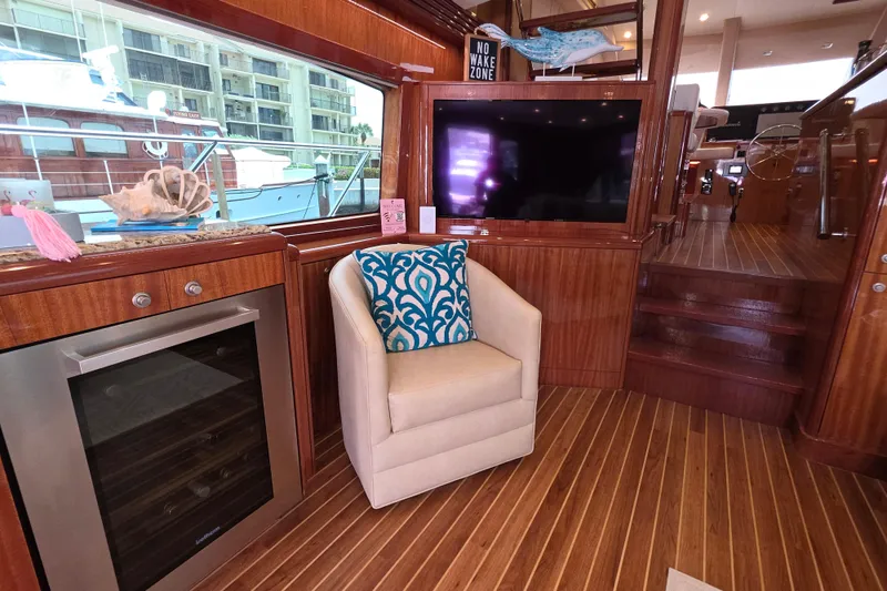 Slide: The Image of Luxurious interior of 2008 Hatteras 64 Motor Yacht with elegant wood finish and cozy seating. - 21