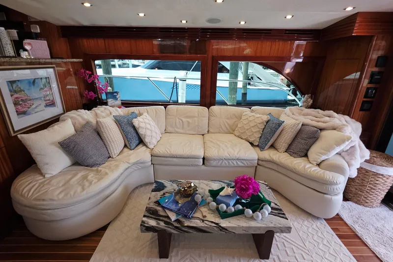 Slide: The Image of Luxurious interior of 2008 Hatteras 64 Motor Yacht with plush seating and elegant decor. - 23