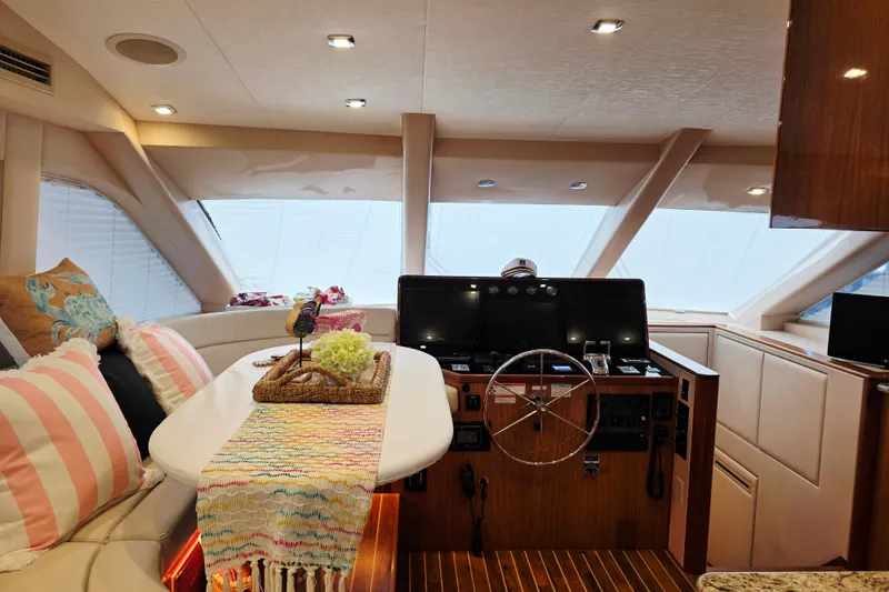 Slide: The Image of Luxurious interior of 2008 Hatteras 64 Motor Yacht with helm and seating area. - 25