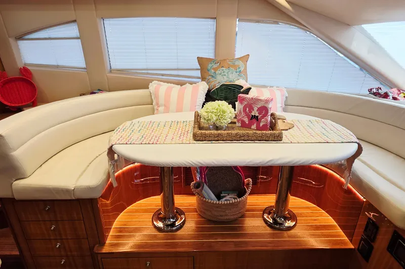 Slide: The Image of Luxurious interior of 2008 Hatteras 64 Motor Yacht with elegant seating and decor. - 26