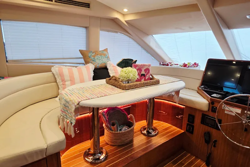 Slide: The Image of Luxurious interior of a 2008 Hatteras 64 Motor Yacht with elegant seating and decor. - 27