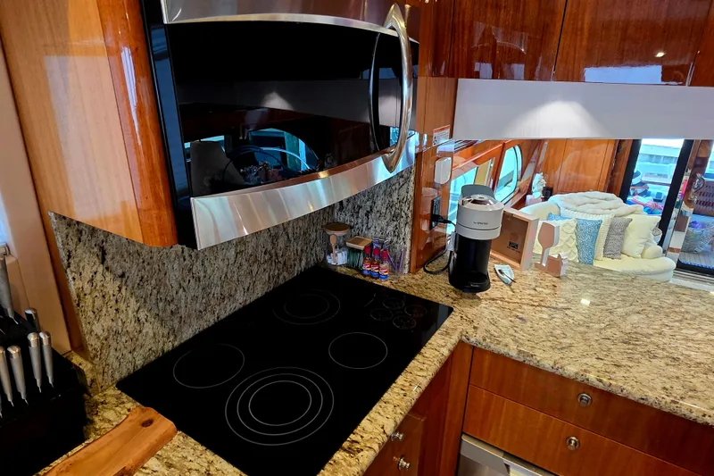 Slide: The Image of Luxurious kitchen interior of 2008 Hatteras 64 Motor Yacht with granite countertops. - 32