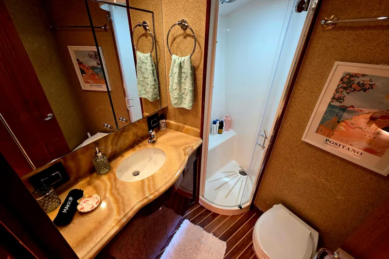 Slide: The Image of Luxurious bathroom in 2008 Hatteras 64 Motor Yacht with elegant fixtures and shower. - 38
