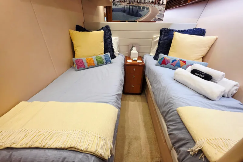 Slide: The Image of Twin beds in a cozy cabin of a 2008 Hatteras 64 Motor Yacht. - 40