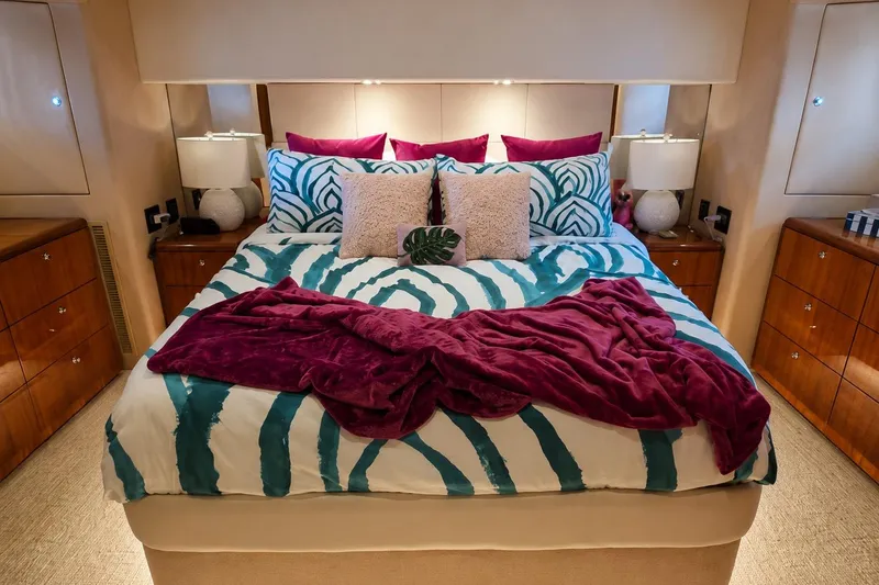 Slide: The Image of Luxurious bedroom interior on 2008 Hatteras 64 Motor Yacht with vibrant bedding and elegant decor. - 42