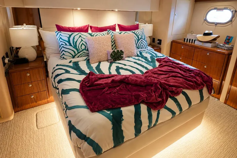 Slide: The Image of Luxurious bedroom interior on 2008 Hatteras 64 Motor Yacht with vibrant bedding and elegant decor. - 44