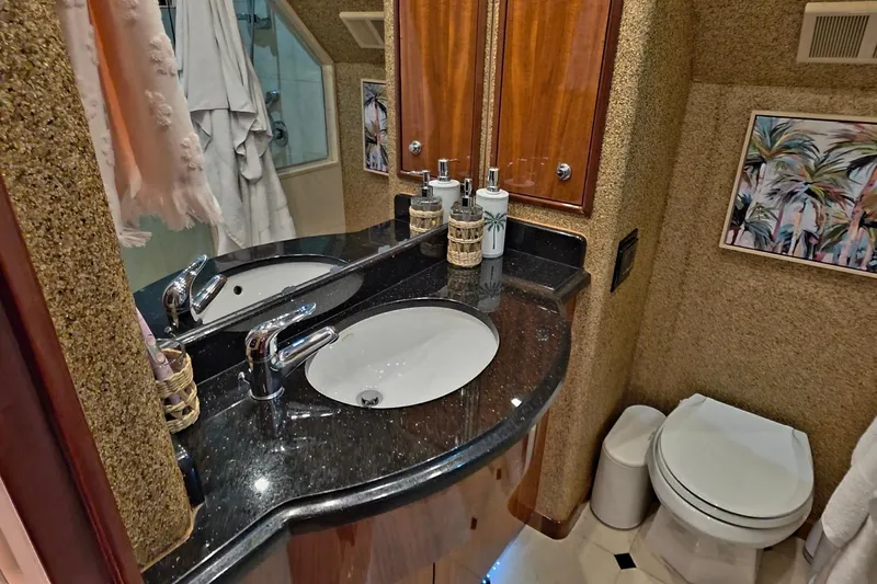 Slide: The Image of Luxurious bathroom in 2008 Hatteras 64 Motor Yacht with elegant fixtures and decor. - 45