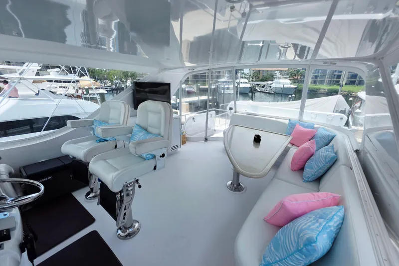 Slide: The Image of Luxurious 2008 Hatteras 64 Motor Yacht interior with plush seating and vibrant cushions. - 47