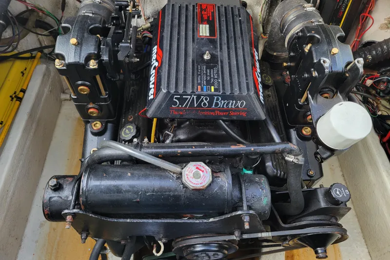 Slide: The Image of Engine of a 1993 Bayliner 2859 Ciera Classic boat, featuring a 5.7L V8 Bravo. - 13