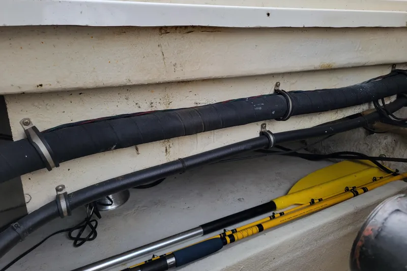 Slide: The Image of Interior view of a 1993 Bayliner 2859 Ciera Classic boat showing cables and paddles. - 15