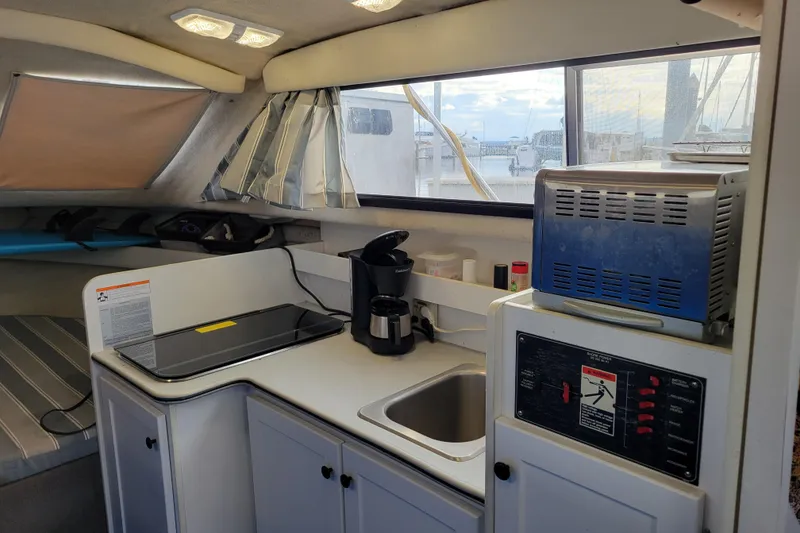 Slide: The Image of Interior of 1993 Bayliner 2859 Ciera Classic boat with kitchenette and appliances. - 9
