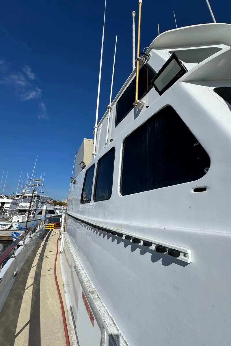 Slide: The Image of 1966 Seaway Commercial Sportfish Vessel docked under clear blue sky. - 11