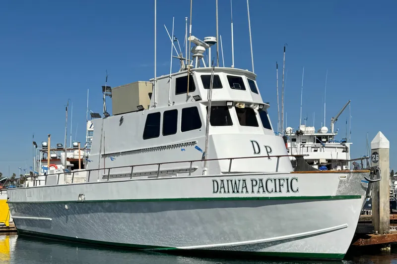 Slide: The Image of 1966 Seaway Commercial Sportfish Vessel docked at marina, named "Daiwa Pacific." - 2