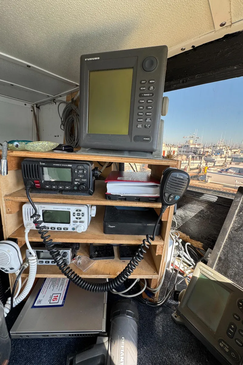 Slide: The Image of Control panel of a 1966 Seaway Commercial Sportfish Vessel with navigation equipment. - 21