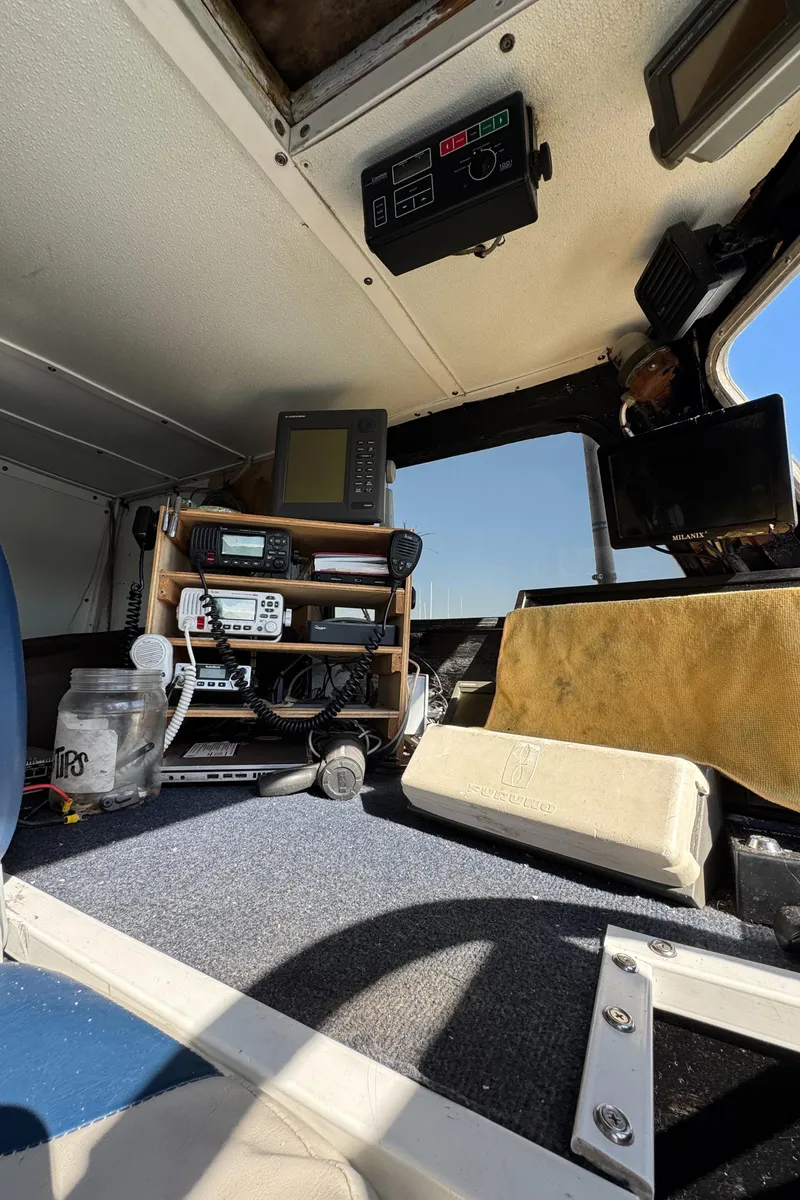 Slide: The Image of Interior of 1966 Seaway Commercial Sportfish Vessel cockpit with navigation equipment. - 23
