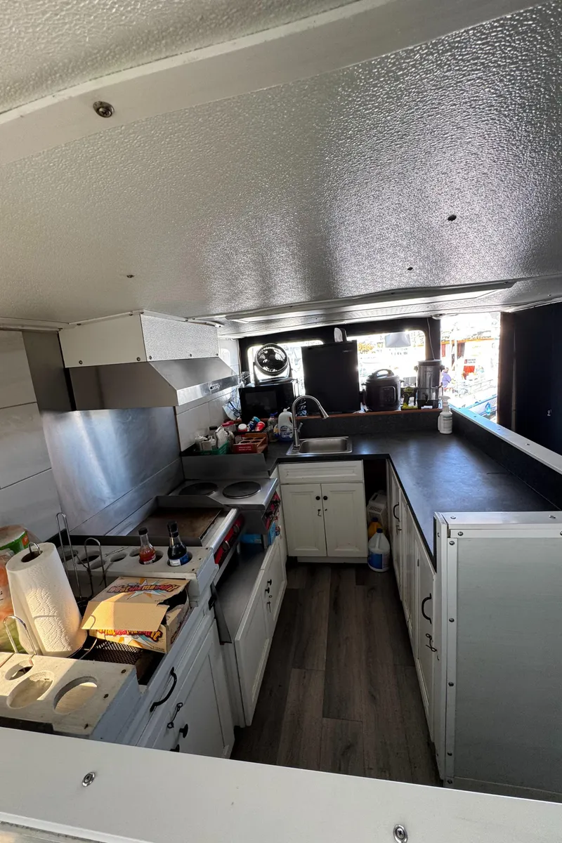 Slide: The Image of Interior of a 1966 Seaway Commercial Sportfish Vessel kitchen with modern appliances. - 28