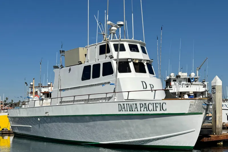 Slide: The Image of 1966 Seaway commercial sportfish vessel docked, named "Daiwa Pacific," with COI certification. - 3