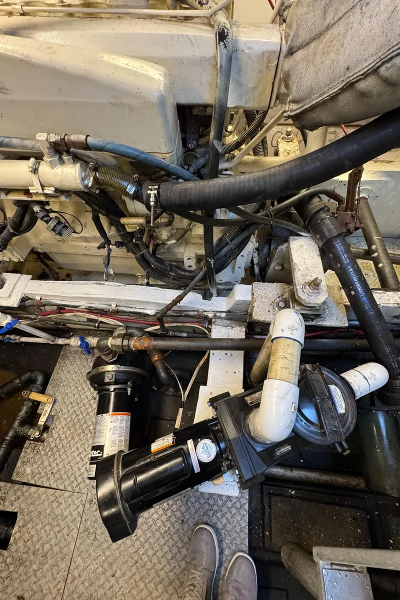 Slide: The Image of Engine room of a 1966 Seaway Commercial Sportfish Vessel with COI, showing pipes and machinery. - 36