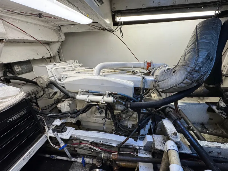 Slide: The Image of Engine room of a 1966 Seaway Commercial Sportfish Vessel, showcasing mechanical components and piping. - 38