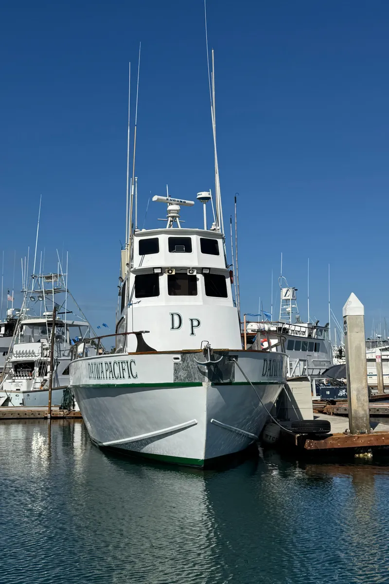 Slide: The Image of 1966 Seaway Commercial Sportfish Vessel docked in marina under clear blue sky. - 4