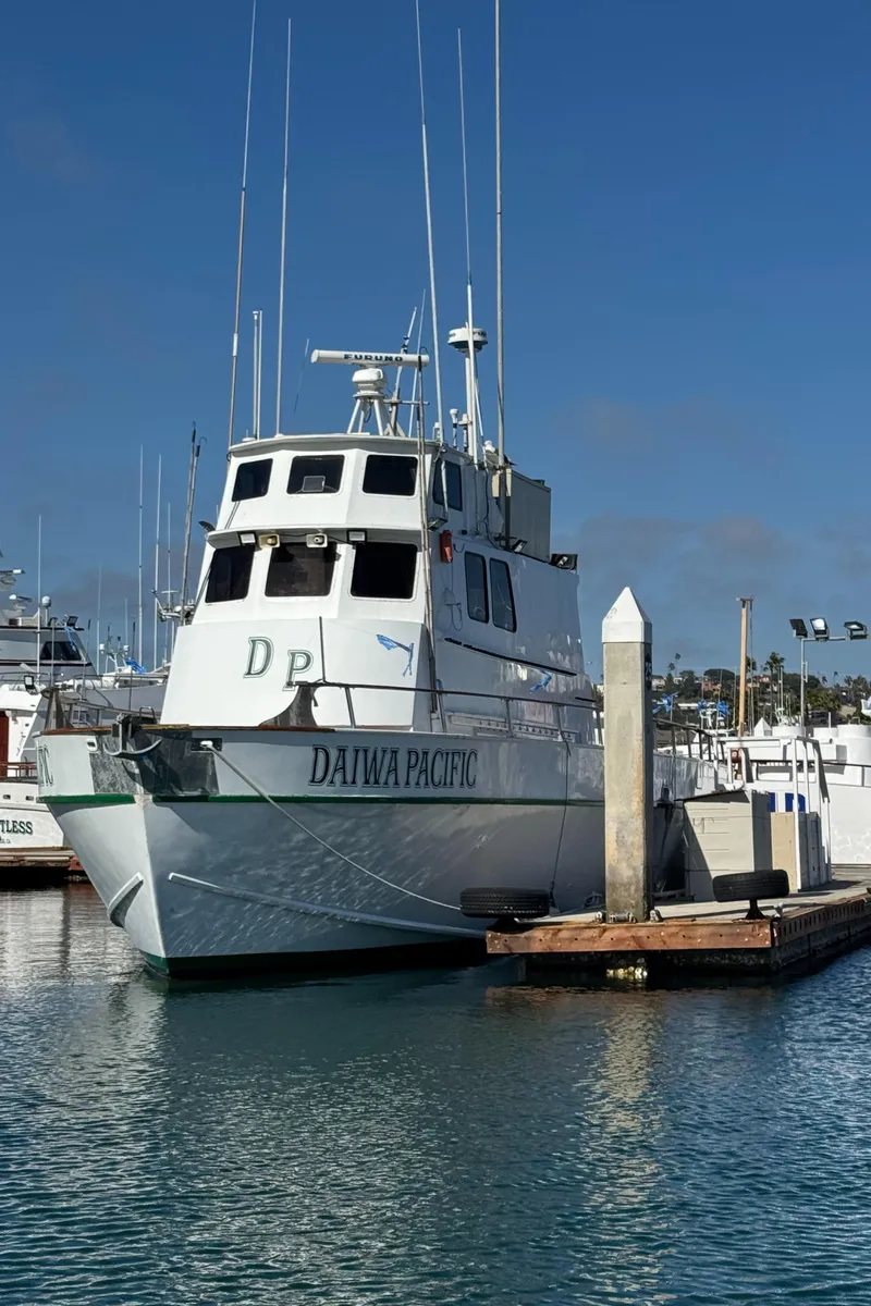 Slide: The Image of 1966 Seaway Commercial Sportfish Vessel docked at marina under clear blue sky. - 5