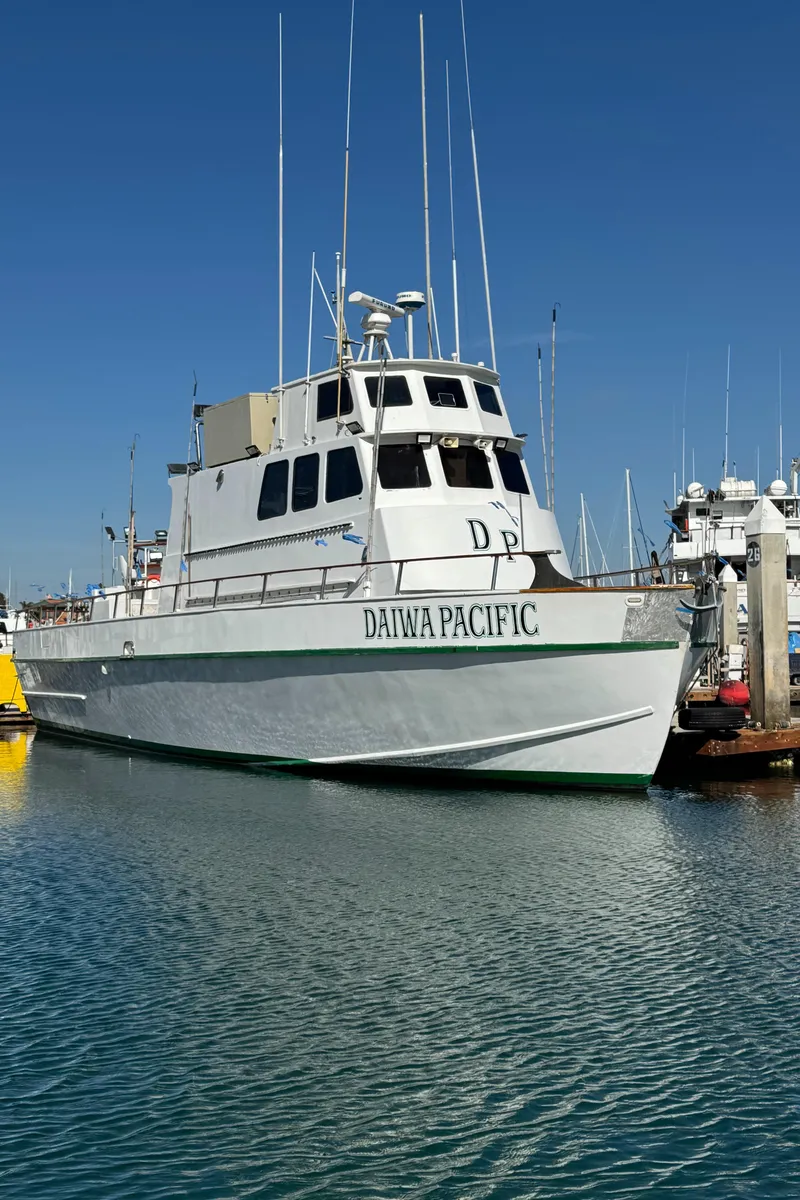 Slide: The Image of Seaway 1966 commercial sportfish vessel docked, clear sky, marina background. - 6