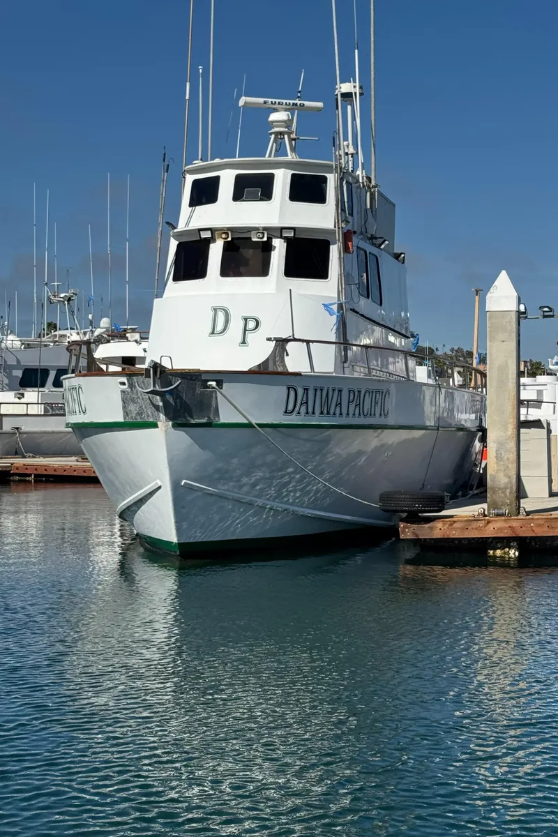 Slide: The Image of Seaway 1966 commercial sportfish vessel docked in marina, clear sky background. - 7
