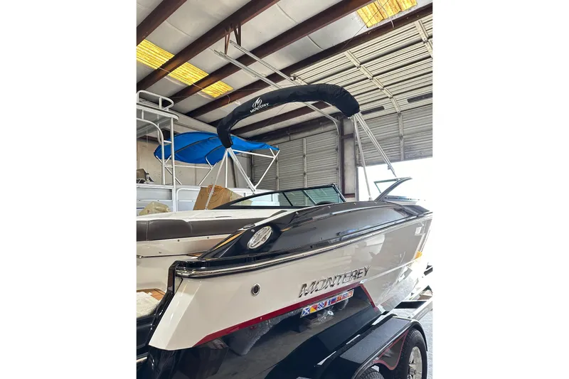 Slide: The Image of 2016 Monterey 238SS Super Sport boat in a storage facility, showcasing sleek design. - 1