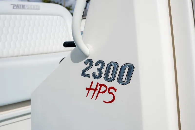 Slide: The Image of 2025 Pathfinder 2300 HPS boat logo on white surface, close-up view. - 12